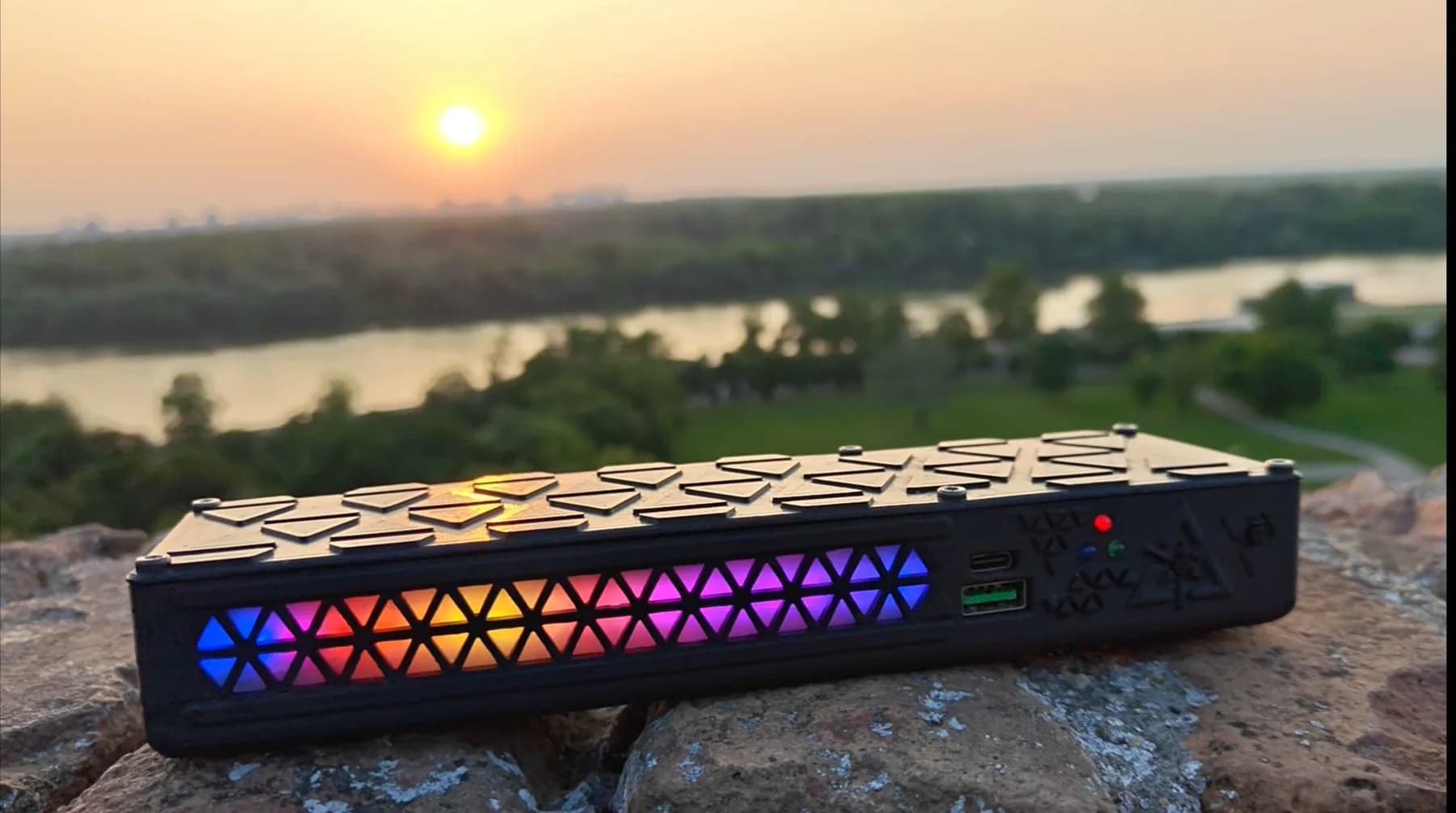 The real, assembled MPB MK2.1 power bank photographed outdoors at sunset